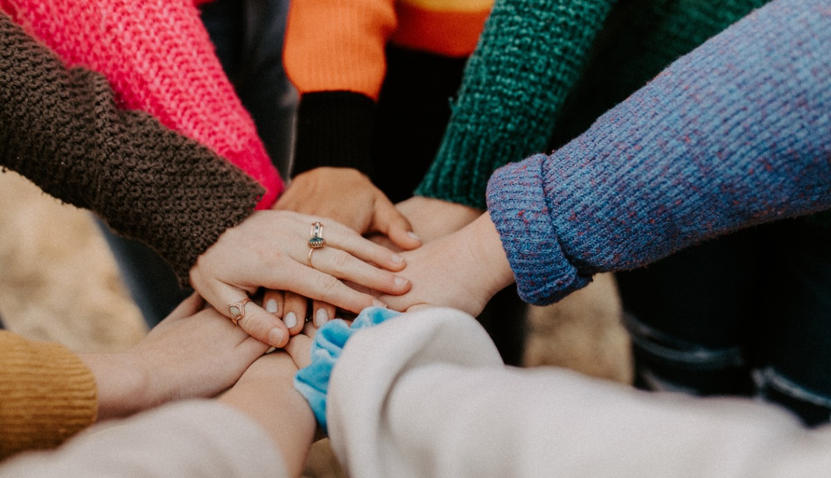 Group of hands in a huddle