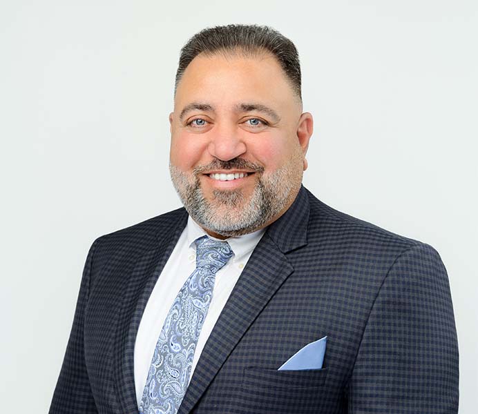 Professional headshot of Amar Deol, Amar Group CEO & President
