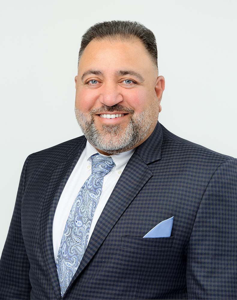 Professional headshot of Amar Deol, Amar Group CEO & President