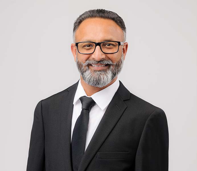 Professional headshot of Kamal Dhaliwal, Amar Group Vice President
