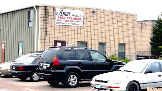Parking lot and exterior photo of Amar’s 2nd Mississauga, ON office and terminal