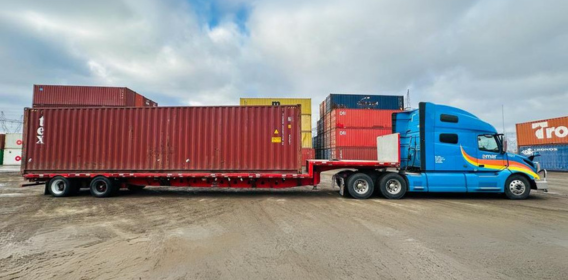 Amar Group Flatbed trailer transporting oversized container freight