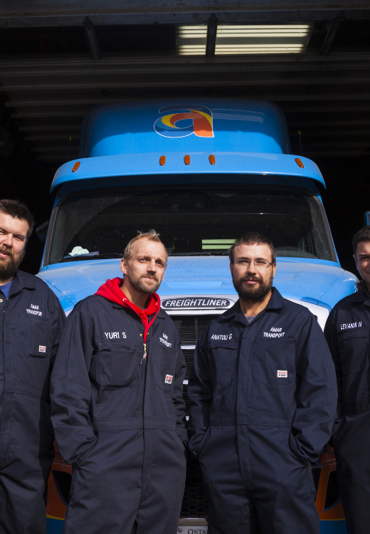 Amar technician staff standing in front of Amar truck