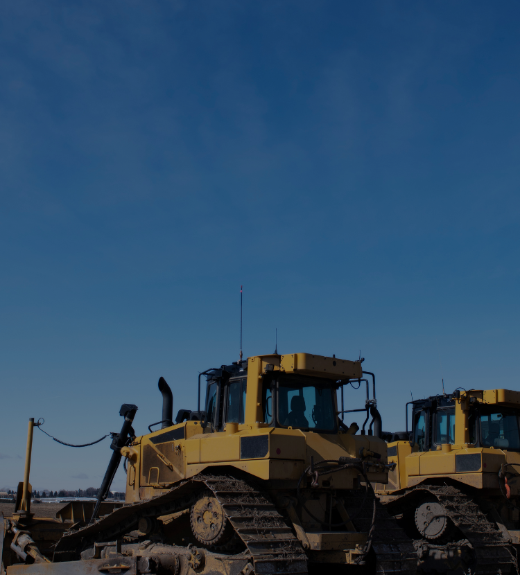 Lineup of parked Amar excavators at real estate development site